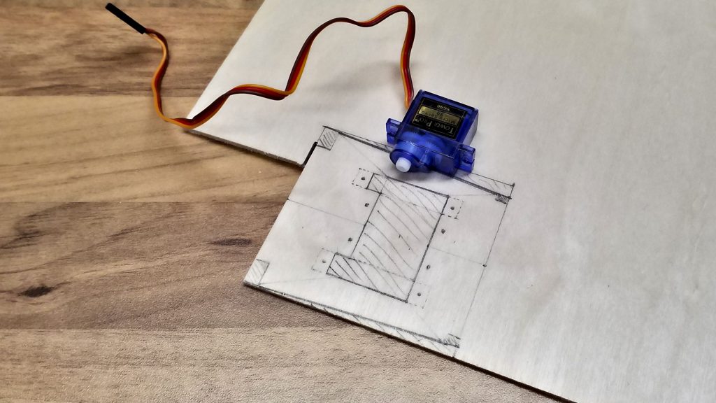 The servo mounting is being drawn.