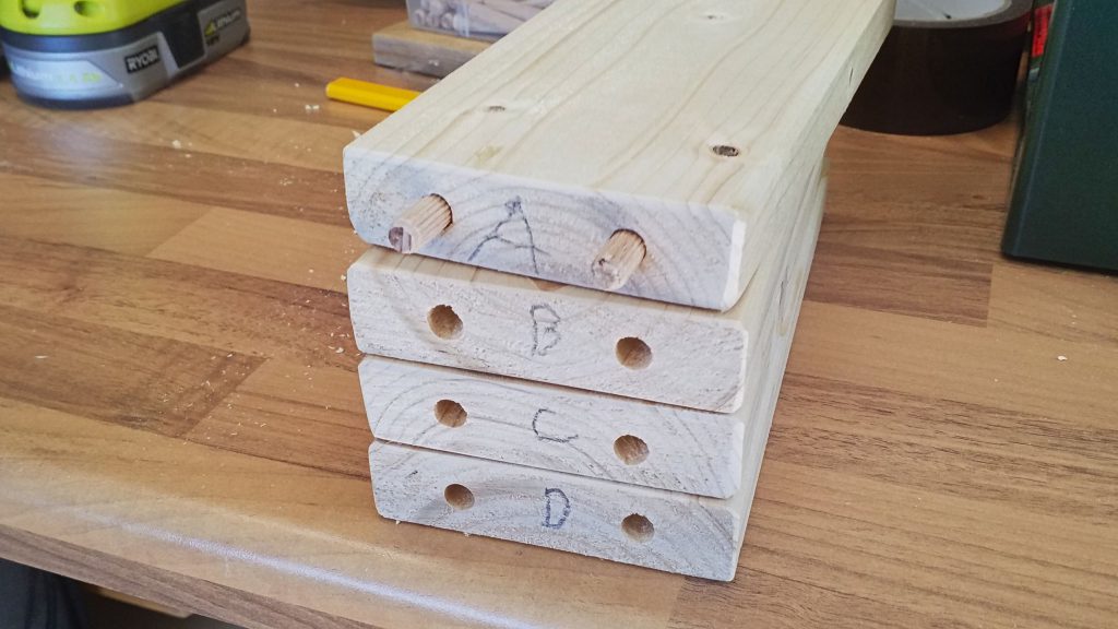 The staves are numbered and the pegs are white glued into place.