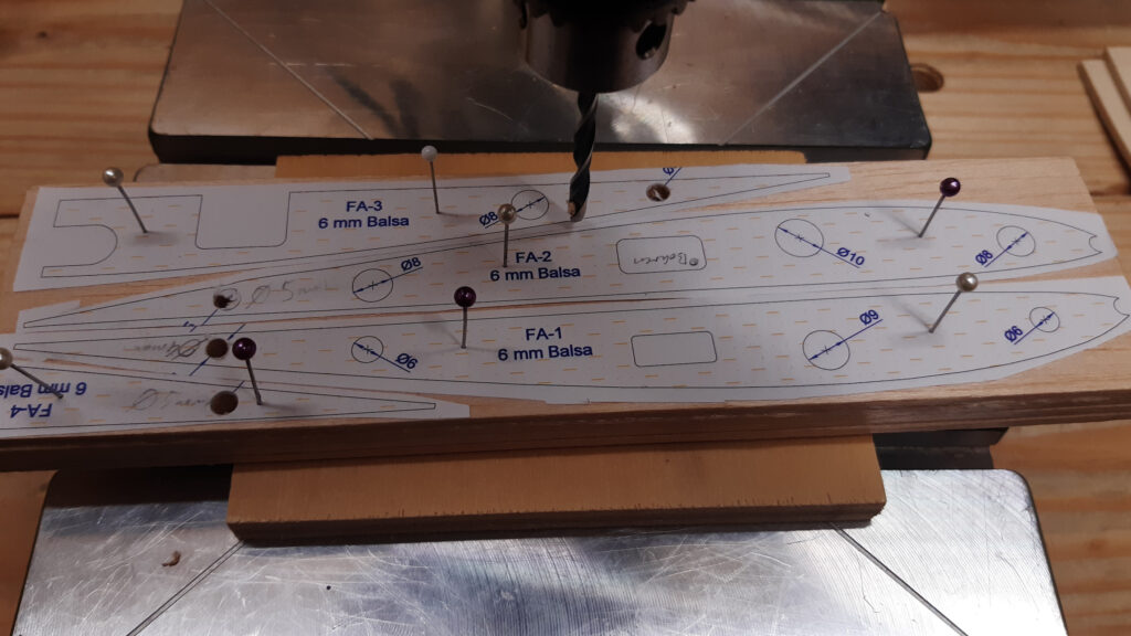 The wing root is made from several layered sheets of balsa wood.